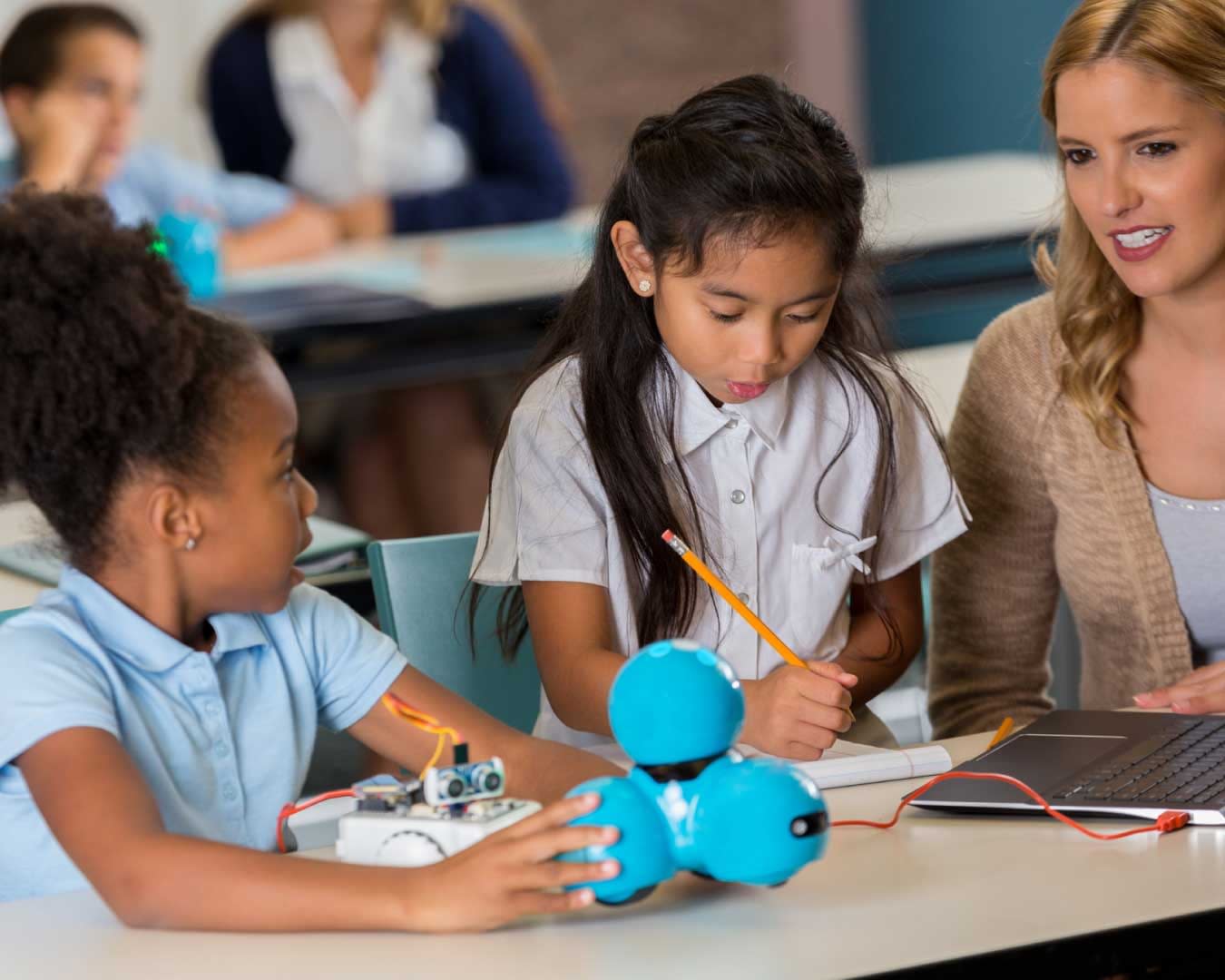 Diverse elementary school girls enjoy class stem assignment