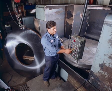 UTRS AM technician using a grinding machine